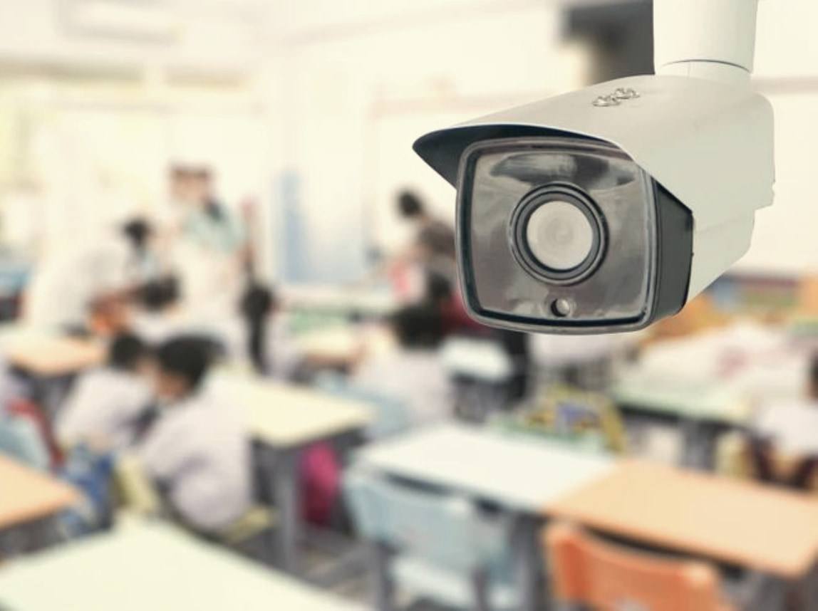 A CCTV camera overlooking a classroom